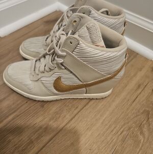 Nike Women’s High-Top Sneakers in Cream with Gold Swoosh